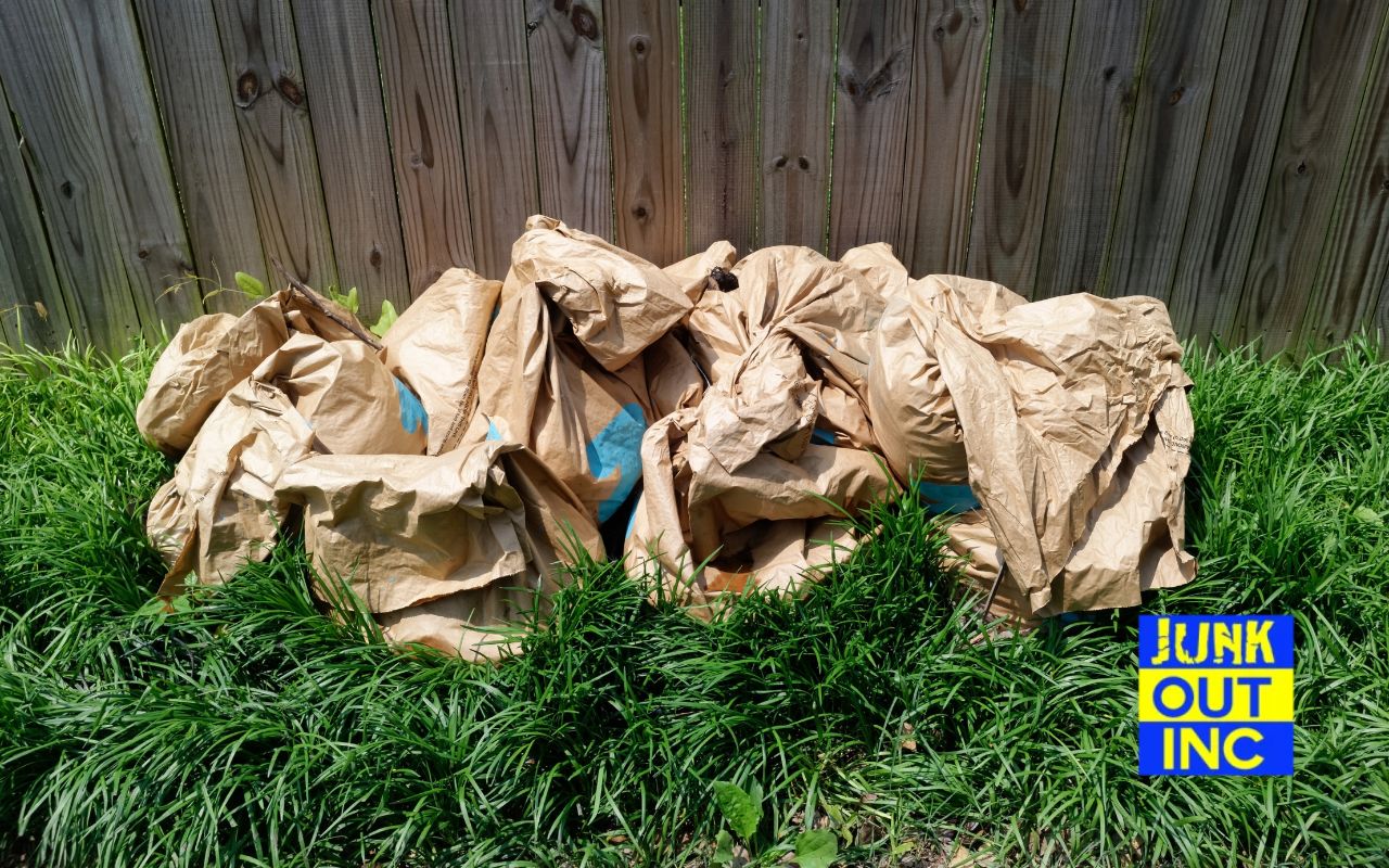 Curbside pickup of yard debris bags.