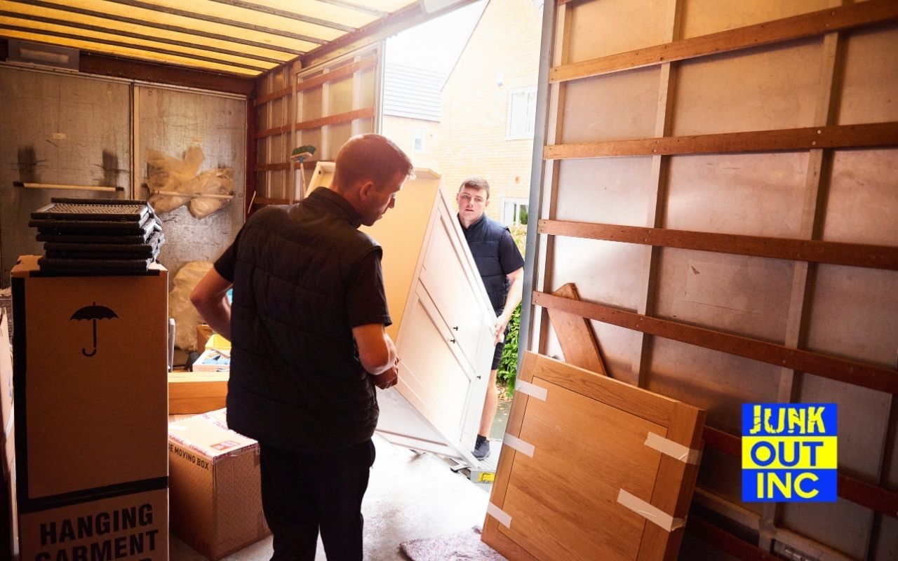 Junk Out Inc truck for furniture removal in Greenwich, NY outside a home