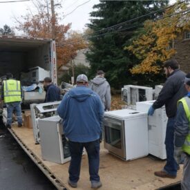 Appliance removal in Greenburgh, NY with Junk Out Inc team loading old appliances safely.